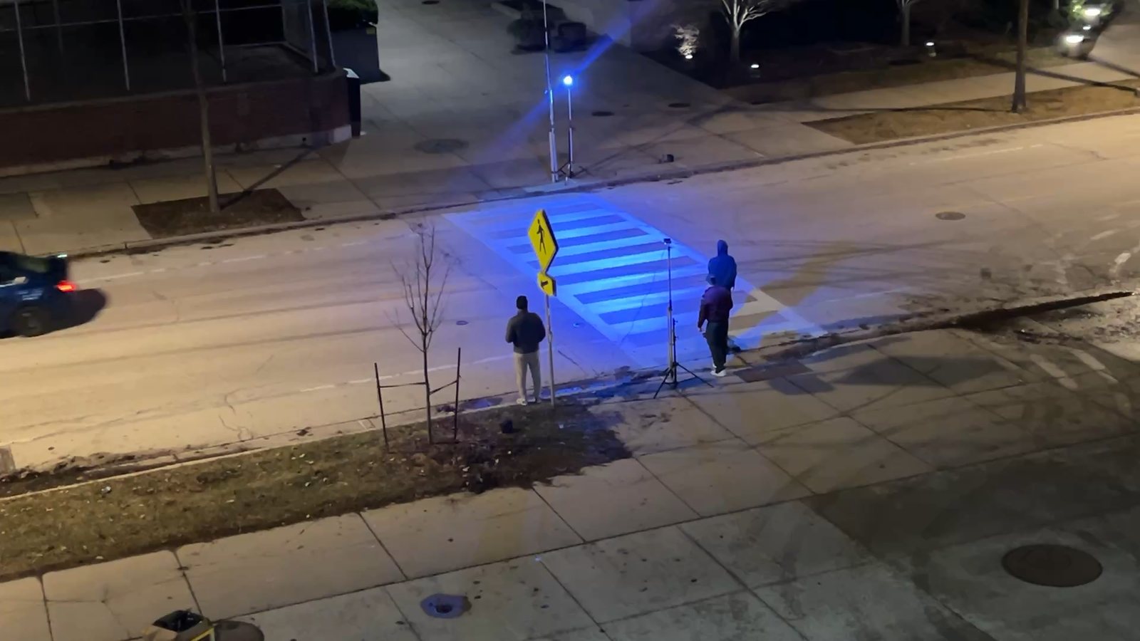 Aerial view of the blue-lit crosswalk during Milwaukee nighttime testing