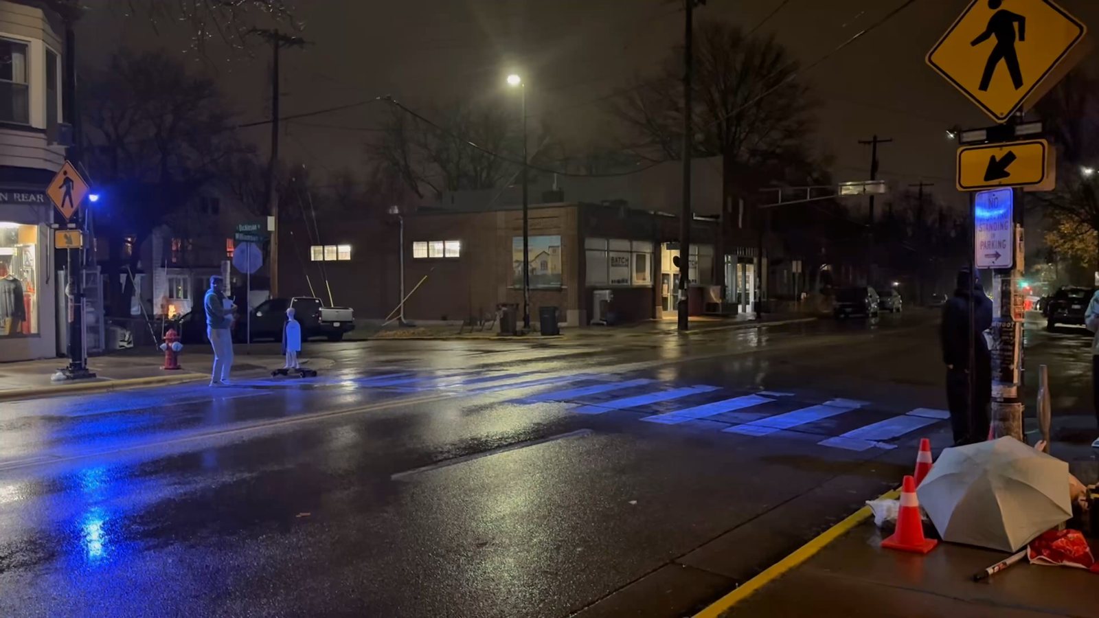 Wide view of the wet Madison test street at night